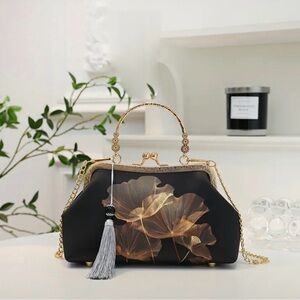 Elegant Black and Gold Handbag